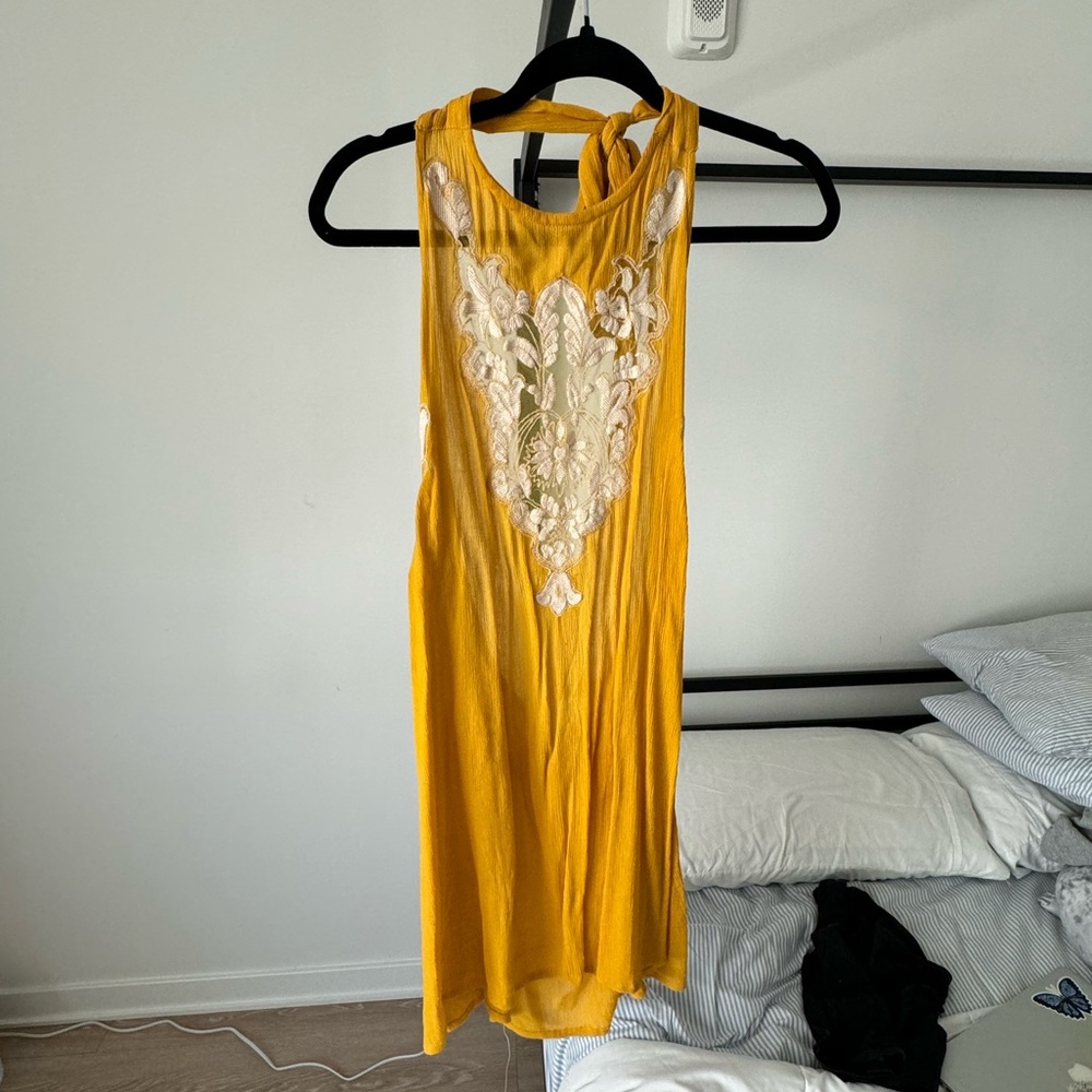 Yellow and white halter dress with low back